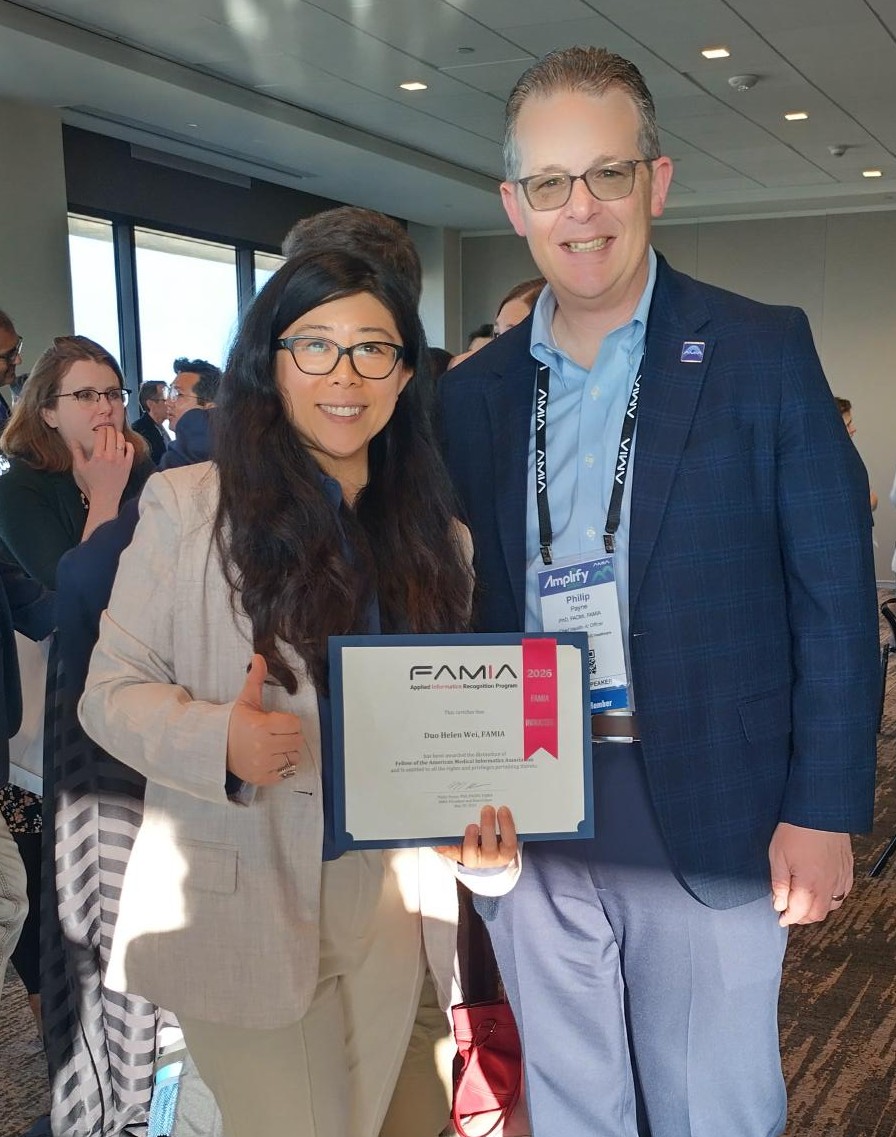 helen wei holds award posing with philp payne