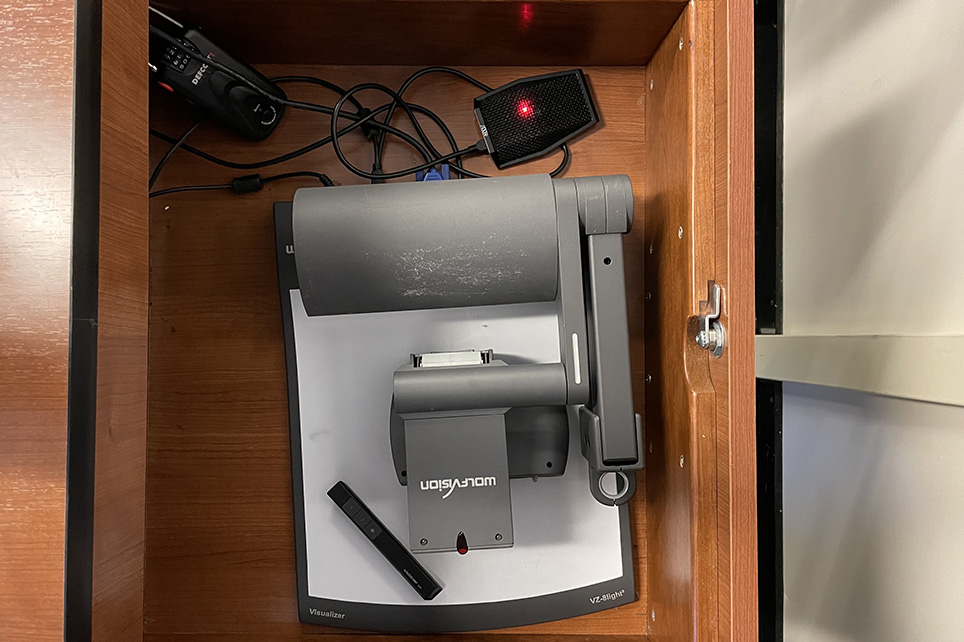 A photograph of a document camera, located in the podium drawer.