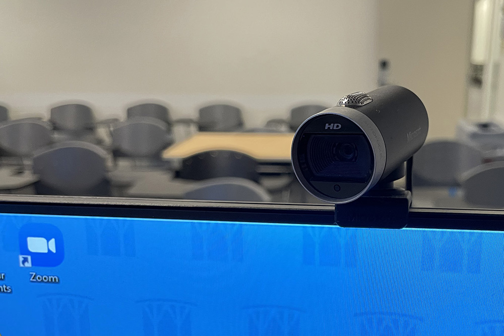 A photograph of a webcam, mounted on top of the podium monitor.