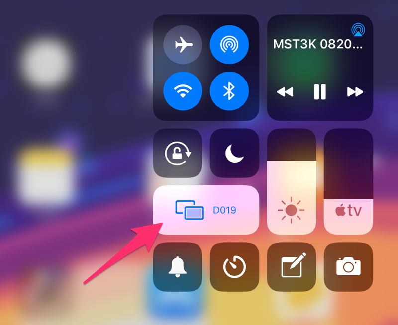 A screenshot of the iOS quick menu, with an arrow pointing to the "Screen Mirroring" button. Because the device is connected to an Apple TV, it shows the device's name "D019" in this example.