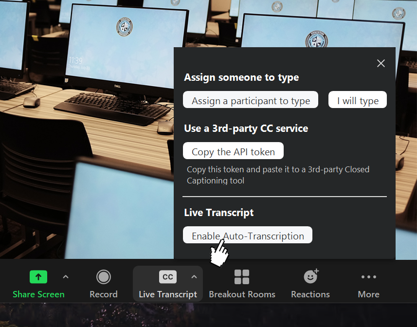  A screenshot of the Zoom interface, indicating towards the Closed Captioning button and the Enable Auto-Transcription button.