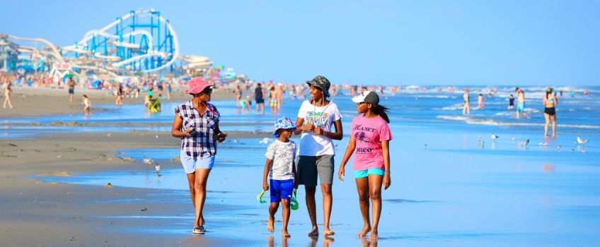 Family on Wildwood Beach with Amusement Pier in Background - with permission Cape May County Tourism