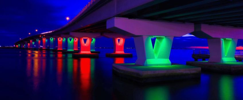 Ocean City Bridge at night with decorative lights at waterline