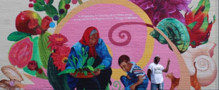 Atlantic City Mural Featuring Elder and Child surounded by flowers, fruits and shells