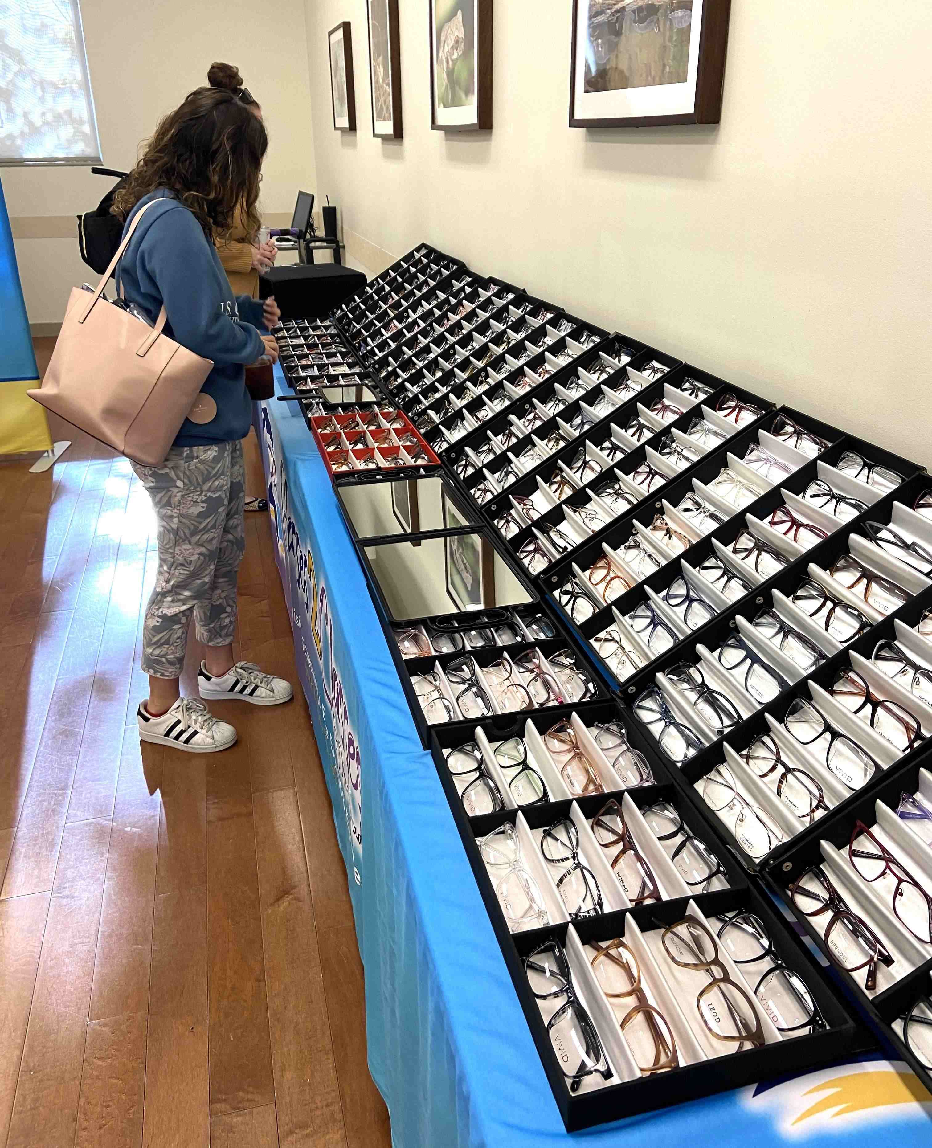 girl looking at glasses