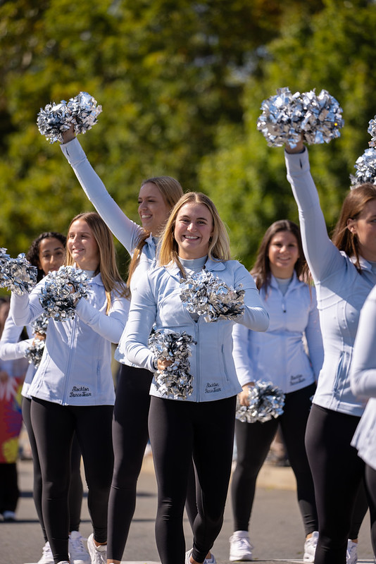 University Cheerleaders smile for the camera during University Weekend.