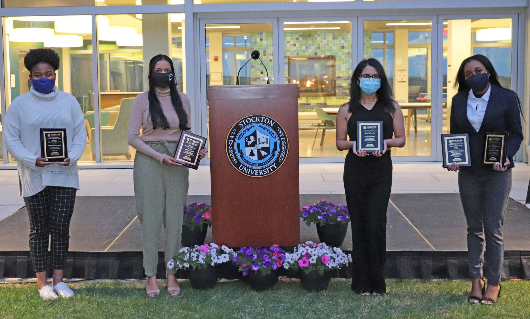 Award winners Kristina Mitchell, Divya Rajput, Diana Ramirez and Danielle Combs pose with their plaques.