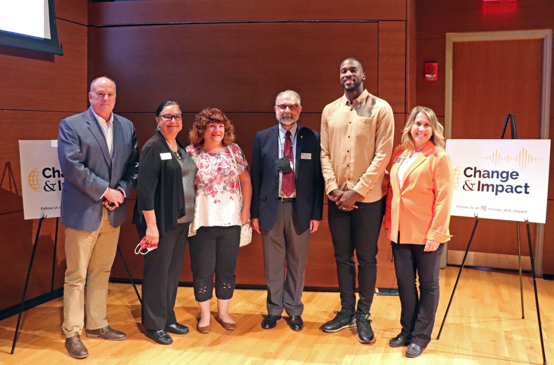 Michael Kidd-Gilchrist and Joe Donaher pose with staff and faculty from Stockton University, in addition to Maria Turner from the Atlantic County chapter of the National Stuttering Association.