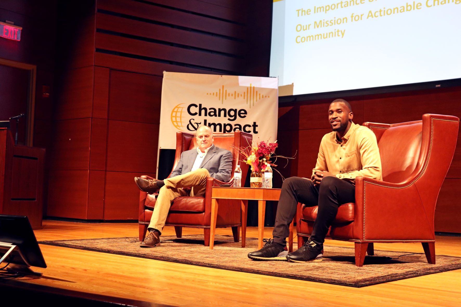 Michael Kidd-Gilchrist and Joe Donaher sit on stage before their panel discussion on stuttering awareness and the Change and Impact Initiative.