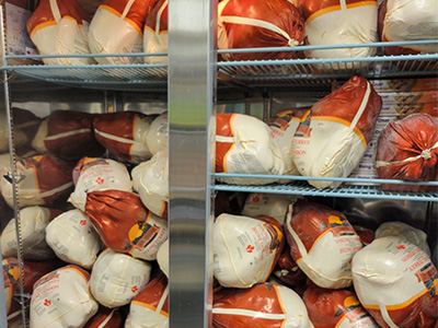 60 frozen turkeys inside of the Food Pantry freezer