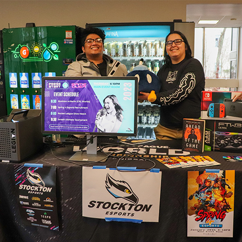 Two members of Stockton Esports at their table during the Get Involved Fair