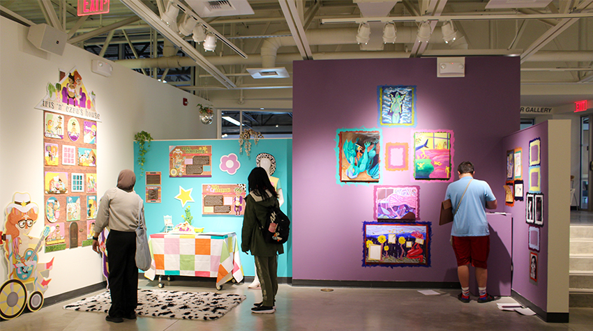 Students checking out last year's BFA Senior Exhibition