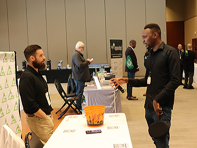 A student talking to one of the vendors at the fair