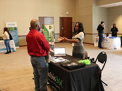 Student talking to a vendor during the fair