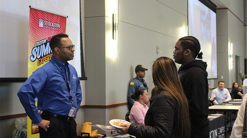 Students talking to Brian K. Jackson of the AC Campus