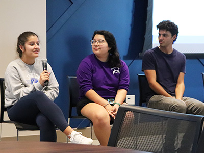 Student panel discussing their topic in front of other students.