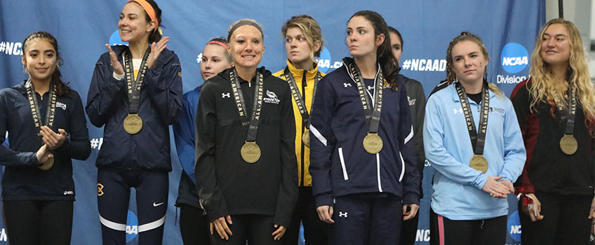 All-American Alicia Belko, front row, first from the left poses with her medal at the NCAA Division III Women’s Cross Country Championship on Nov. 19 in Illinois
