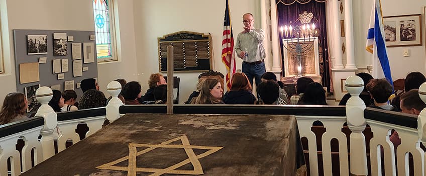 Tom Kinsella, the director of Stockton University’s Alliance Heritage Center, speaks to a group of Egg Harbor Township High School students in April about the history of the Alliance Chapel in Pittsgrove Township, Salem County.