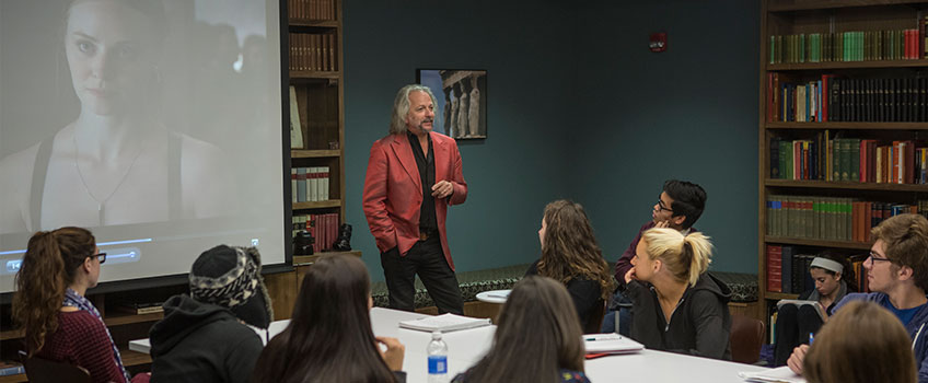 Professor instructing students in a classroom