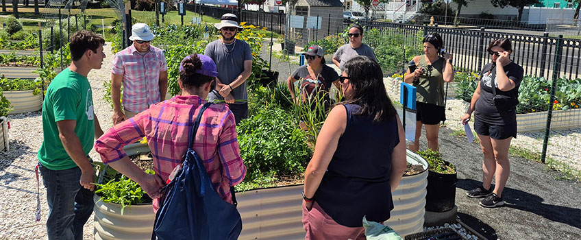 Teachers work at the Community Garden at Fishermen’s Park in Atlantic City