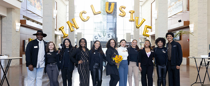 The CEO interns surrounding Ana Edmondson, interim assistant vice president for Student Transition Access and Retention, during the inaugural Inclusive Leadership Conference on April 14.