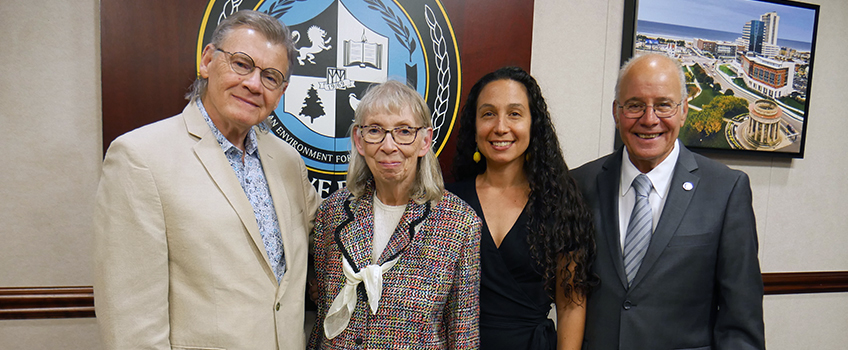 From left, Peter and Sonya Murphy present a check for $10,000 to Emari DiGiorgio, faculty director of Murphy Writing of Stockton University,  and Stockton University President Harvey Kesselman.