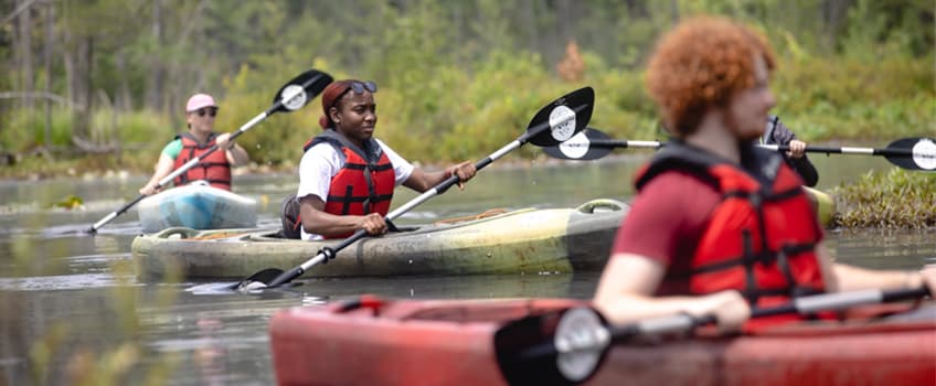 Attendees kayaking in the Mullica River