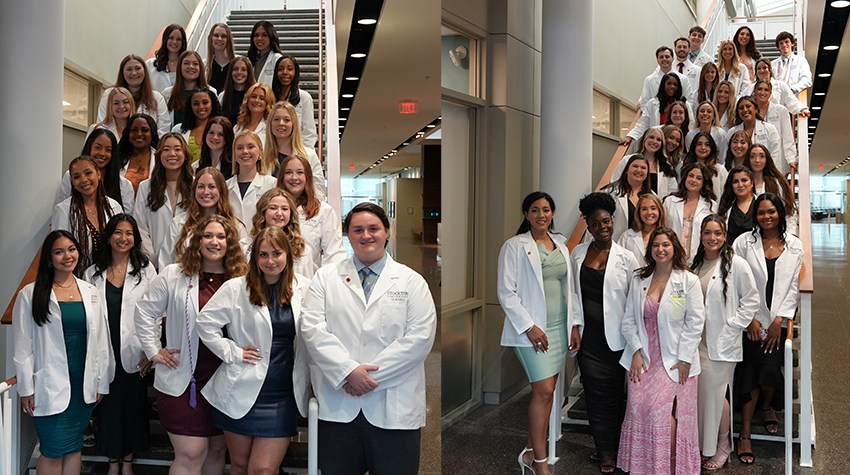 Nursing graduates on the stairs of the Campus Center