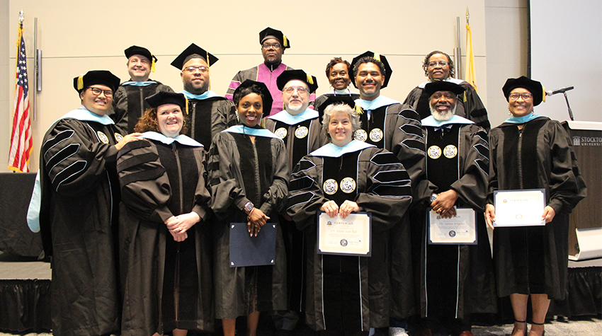 Doctoral candidates after being hooded