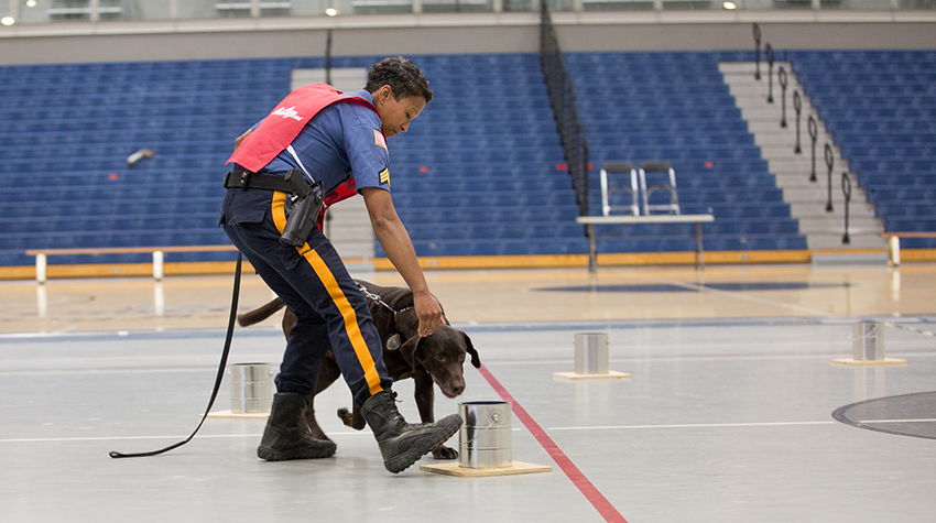 Hemi demonstrating his skills on campus with Lt. Tracy Stuart.
