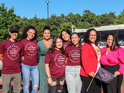 Members of Los Latinos Unidos posing with Aleyshka Barbosa, Jessica Grullon, Ana Edmondson, and Heather Medina. 