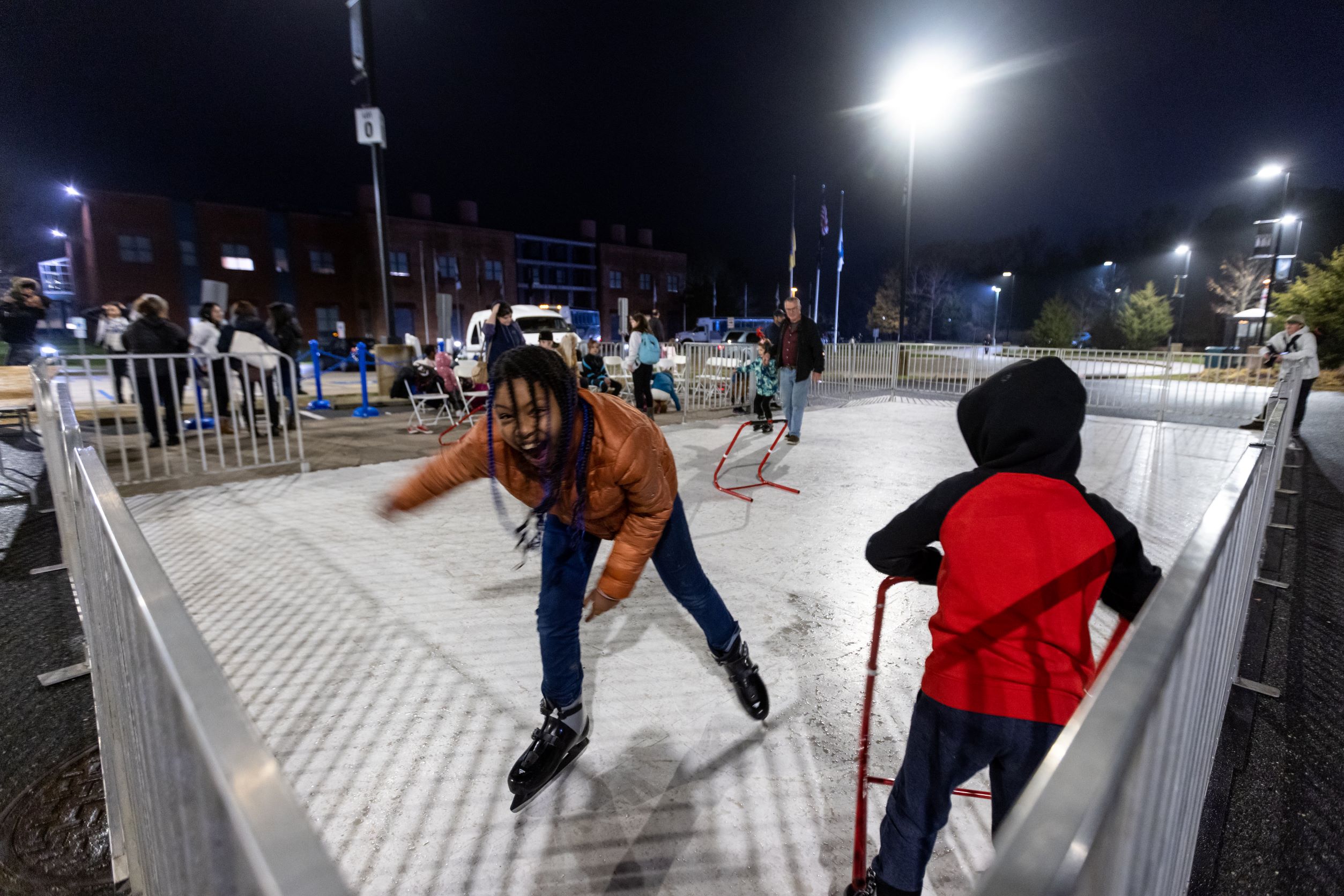 Alumni and their families enjoy the ice skating rink at the second annual Winter Tree-dition.
