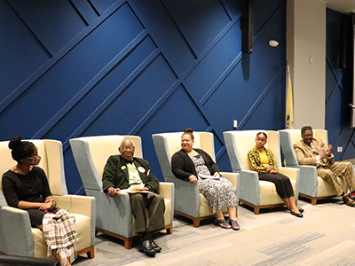 The panel sitting in their chairs, ready to start the discussion