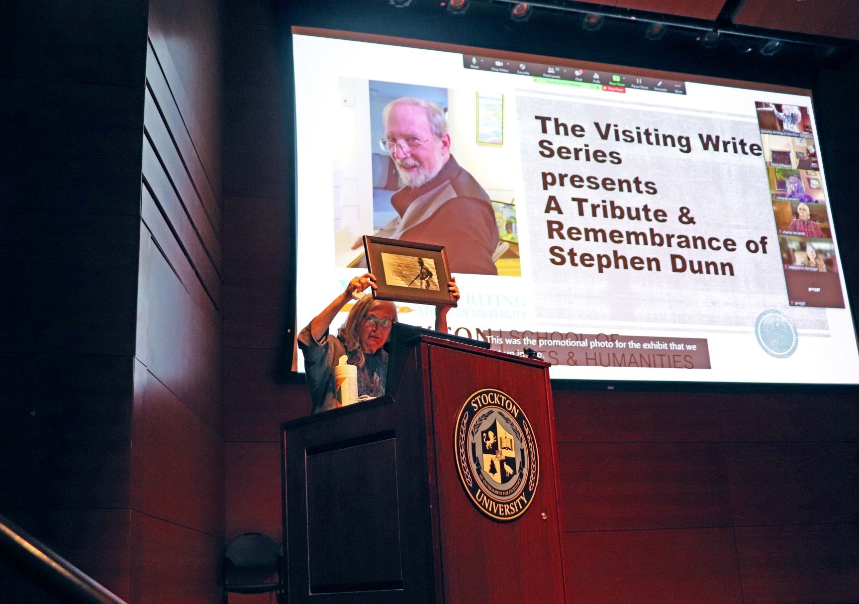 Lisa Honaker, dean of the School of Arts and Humanities and professor of British Literature, held up a photo of Dunn in a hat smoking a cigar while holding a shotgun, which she explained was used as the promotional photo for an exhibit on Dunn’s work in 2011.