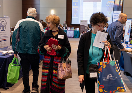 Attendees browse exhibitions