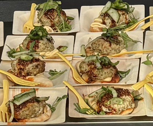 chicken ginger naan dish on serving plates with forks