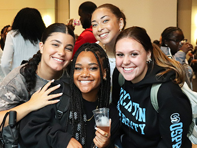 Group of students smiling and posing for the camera.