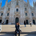 Eline Xia sits in front of the Duomo di Milano in Milan, Italy.