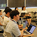 Students from Jeju National University in South Korea discuss machine learning during a class at Stockton.
