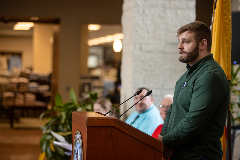 Luke Lallos speaking to the crowd at the ceremony