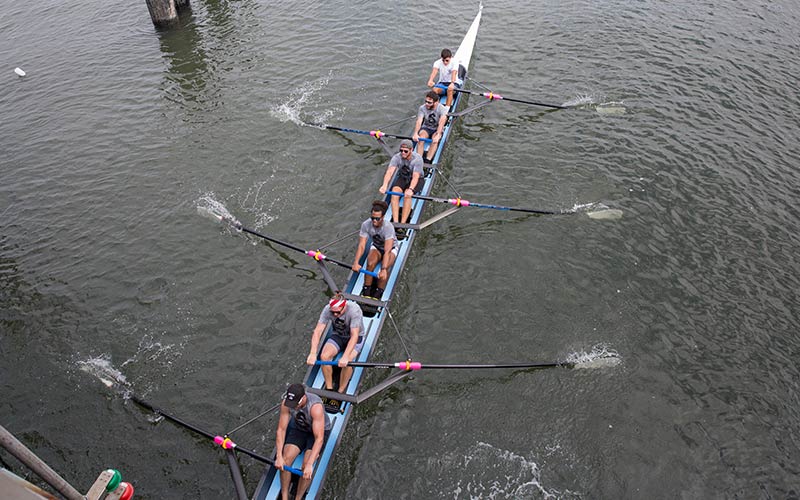 Men's rowing team on the water