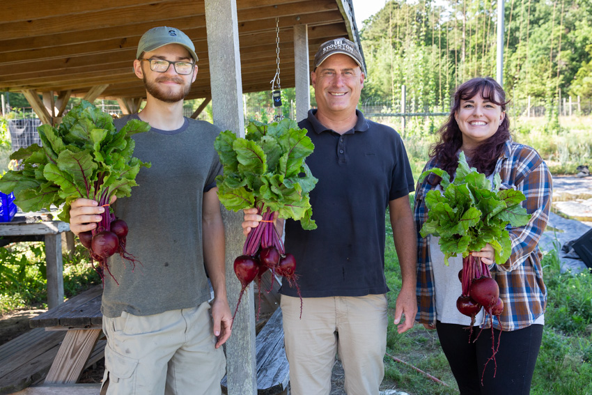 Ron Hutchison and farm interns