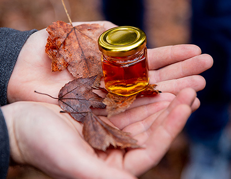 Image of maple syrup and leaves