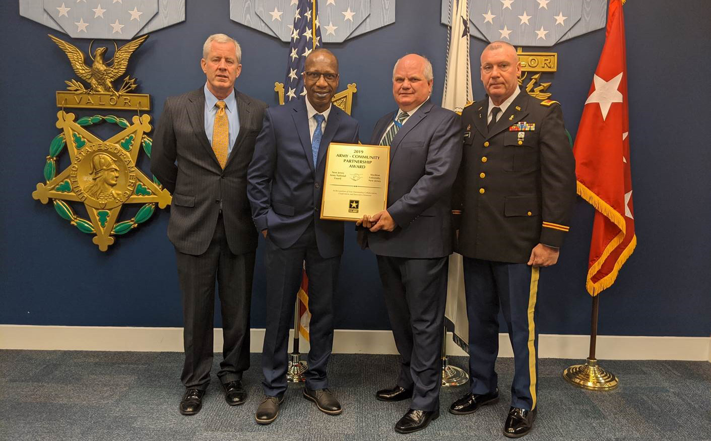 Image of Dr. Tait Chirenje at the Pentagon receiving an award on behalf of Stockton University