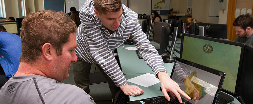 Image of students working planning software in computer lab