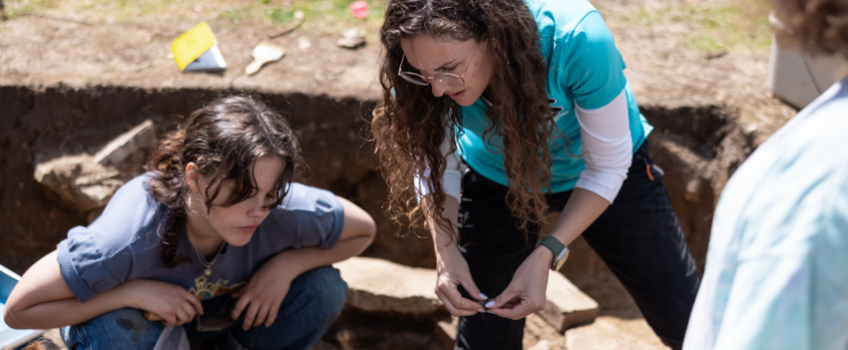Student Sage Rosenberg, left, and Professor Bobbi Hornbeck work inside a circular shaped depression on the property of the Museum of Cape May County.