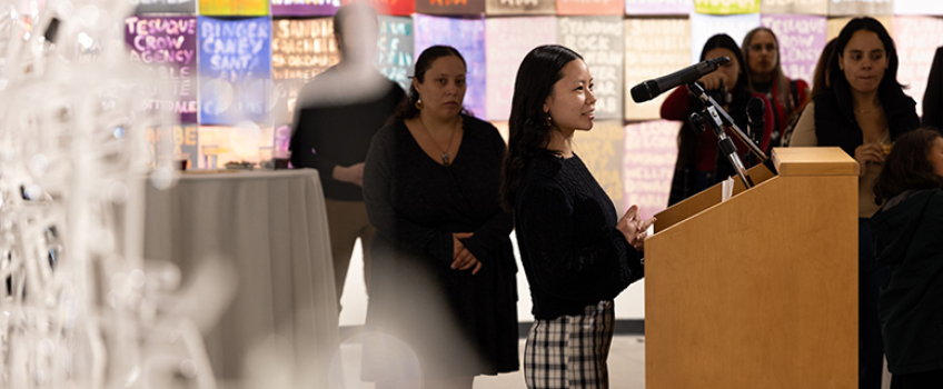 Heather McCarty alumna of the Dual Degree, SOAN/MAAS, giving closing remarks at the "Indigenous Approaches, Sustainable Futures" art exhibition in September 2024