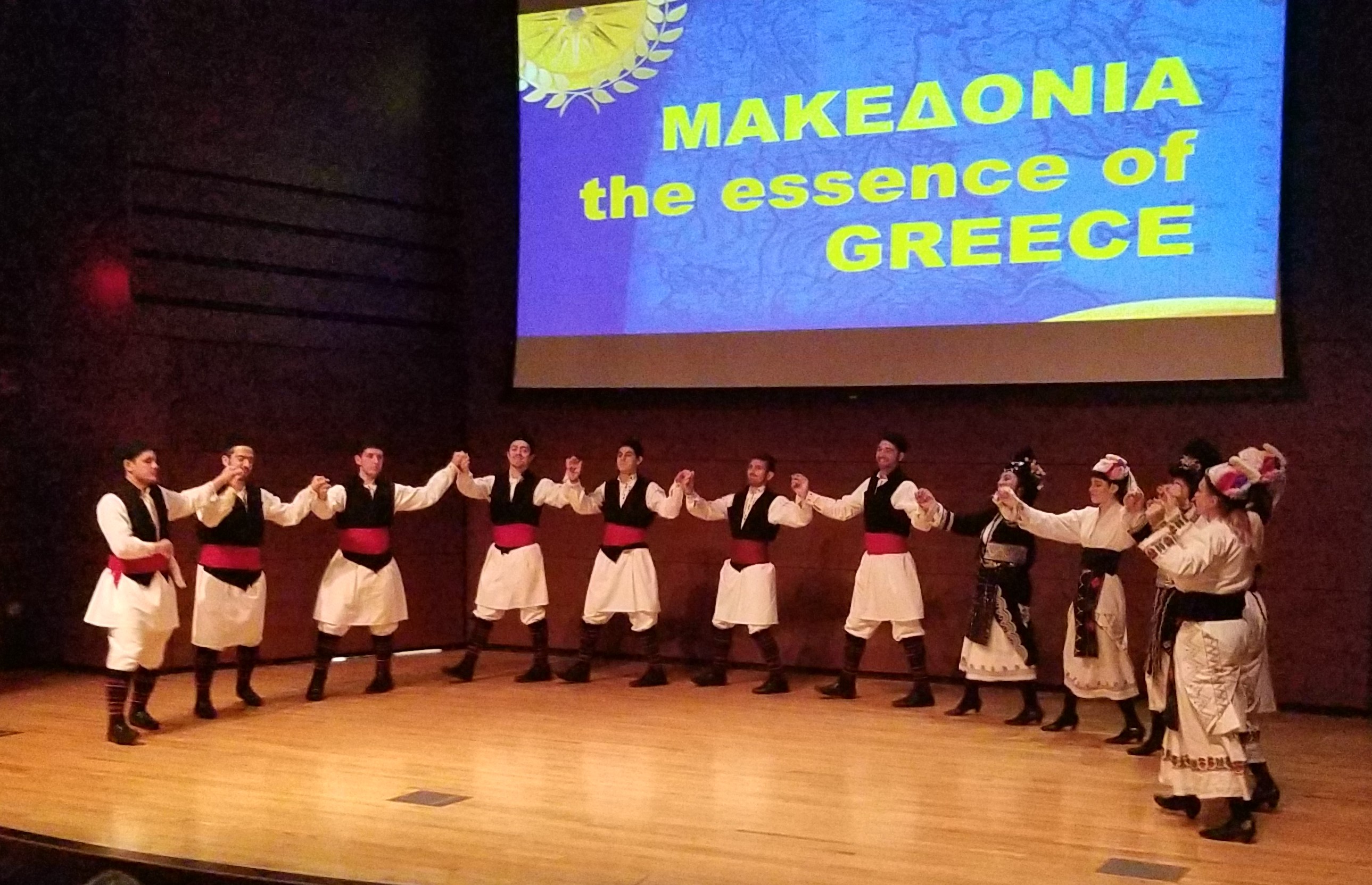 The Macedonian Dancers of Philadelphia perform on the Campus Center Theatre stage. 