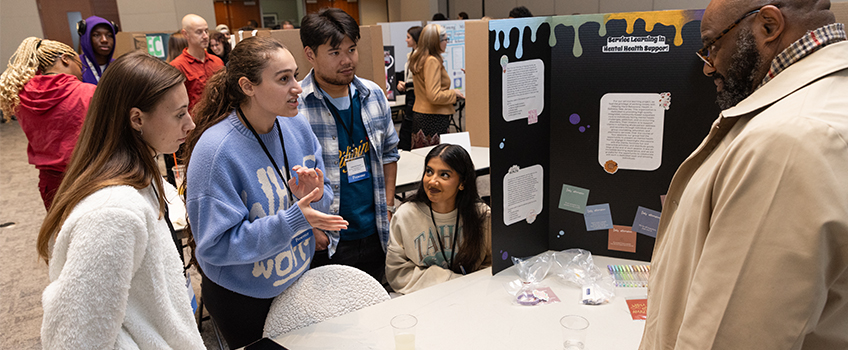 students at poster presentation