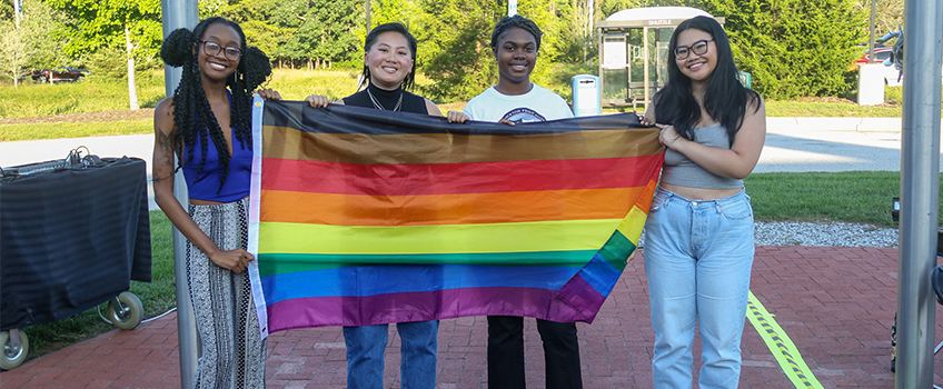 students with rainbow flag 